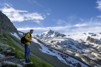 Mountaineer in front of high alpine mountain landscape, summit of the Aiguille de Chardonnet and