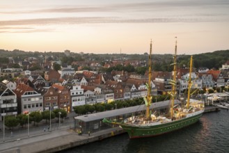 Bark Alexander von Humboldt II and the old town centre of the Baltic Sea resort of Travemünde, Bay