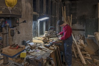 Young man at a Flex in his workshop, Mecklenburg-Vorpommern, Germany, Europe