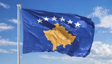 Flags, the national flag of Kosovo flutters in the wind