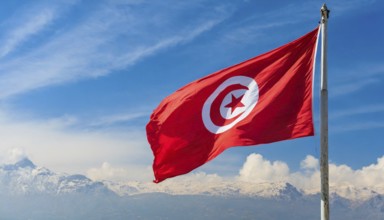 Flags, the national flag of Tunisia flutters in the wind