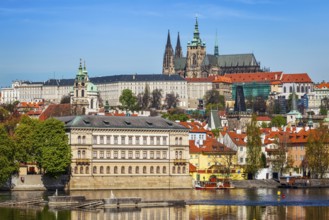 View of Charles bridge over Vltava river and Gradchany Prague Castle and St. Vitus Cathedral