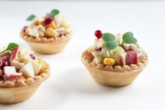 Canapes with salad, corn with crab sticks, appetizer, portioned, close-up, no people