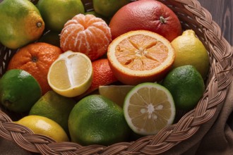 Assortment, citrus fruits, in a basket, close-up, top view, no people