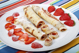 Swabian cuisine, filled pancakes, Flädle with strawberry jam and icing sugar, Gsälz, fresh