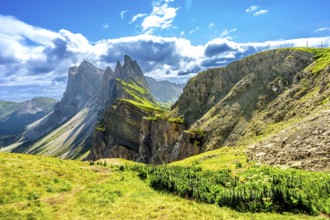 Majestic peaks of seceda mountain glowing under the summer sun in val di funes, dolomites, italy