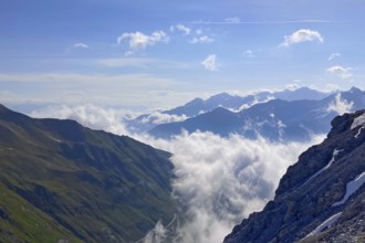 Clouds hanging low in drifting through alpine valleys alpine valleys mountain valleys below