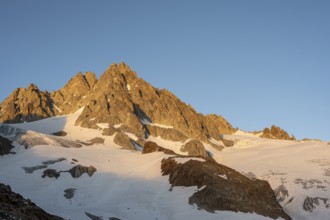 Rocky mountain peak, summit of the Aiguille de Tour in the evening light at sunset, Chamonix,