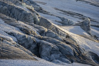 Glacier ice with crevasses in the evening light, Glacier du Tour at sunset, High alpine mountain
