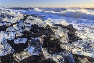 Ice floes on the beach, waves, sea, sunny, morning light, winter, Diamond Beach,