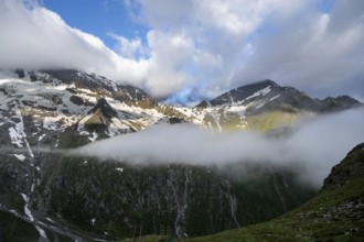 Cloudy mountain landscape with summit Hochsteller and Griesferner with snow and glacier, Berliner
