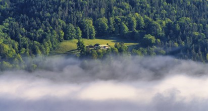 Morning fog over the village of Berchtesgaden in the valley, Bavaria, Germany, Europe