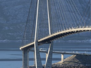 Helgeland bridge, connecting Sandnessjøen with the norwegian mainland, tourbus on bridge, Norway,