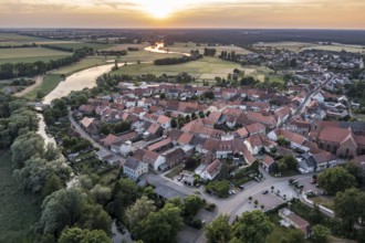 Aerial view of village Lenzen and river Loecknitz (Löcknitz) at sunset, Brandenburg, Germany,