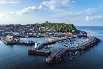 Scarborough Lighthouse and Harbour from a drone, Vincent Pier, Scarborough, North Yorkshire,