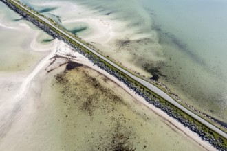 Aerial view of a bridge over turquoise sea at a sandy beach, fjord Grunnforfjorden, Lofoten