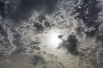 Sun shining through dark clouds, cloudy sky, Granada, Andalusia, Spain, Europe
