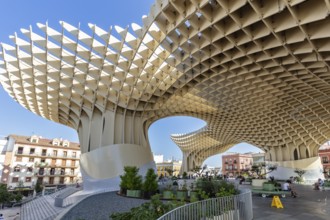 Imposing wooden structure Metropol Parasol under a blue sky, with spacious open areas, Seville