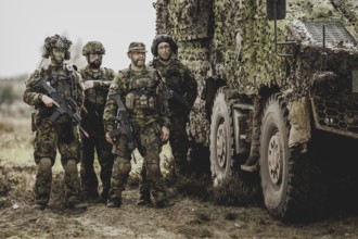 Armed soldiers, photographed as part of a Bundeswehr exercise with armed forces from Norway and the