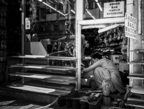 Black and white photography, shoe shops and craftsmen in Al Fahidi neighbourhood, Dubai, United