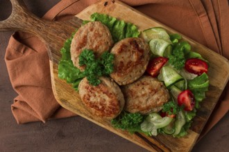 Fried cutlets, turkey, with vegetable salad, top view, no people