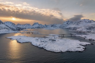 Snowy mountains by the fjord, bridges over fjord near Fredvang, Lofoten, Norway, Europe