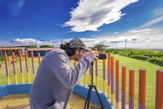 Photographer photographing a beautiful landscape. Person photographing landscape with a digital