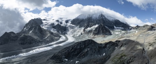 Aerial view, mountain landscape with glacier tongue Glacier de Cheilon and summit Mont Blanc de