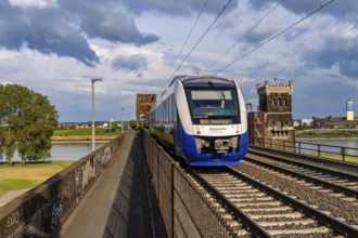 The railway bridge Duisburg-Hochfeld-Rheinhausen, over the Rhine, regional trains and many goods