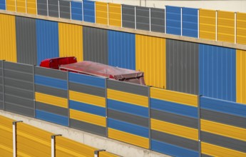 Colourful noise barriers on the A52 motorway, at the Essen-Rüttenscheid junction, the noise