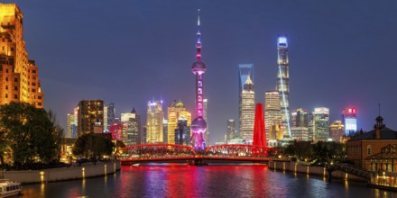 Shanghai skyline at the Bund with Oriental Pearl Tower city centre downtown panorama at night in