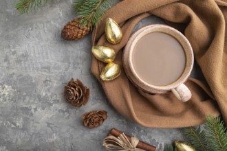 Christmas or New Year composition. Decorations, cones, cinnamon, fir and spruce branches, cup of
