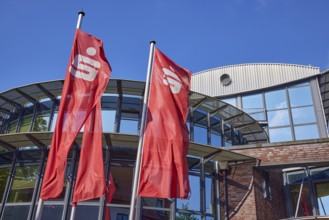 Flags with the Sparkasse logo in front of the Sparkasse Stade-Altes Land branch in Stade, Hanseatic