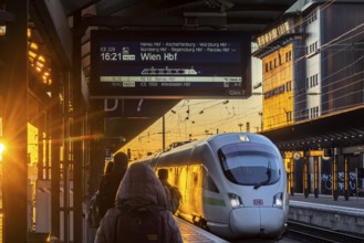 Platform in the evening, ICE arriving at the main station. International direct connection to