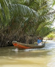 Vietnamese Woman ina rowing boat, Mekong Delta, Vietnam, Asia