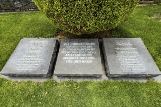 Three memorial plaques at the Maleme military cemetery with the names of the crew of a plane that