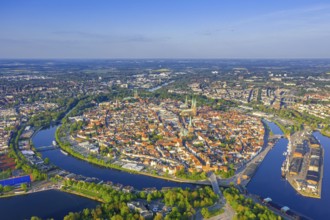 Aerial view over the river Trave and church towers in the old town of the Hanseatic City of Lübeck