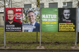 Board with election posters, SPD, CDU, Bündnis90 Die Grünen, FDP, Bundestag election 2025, Kamen,