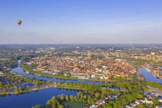 Aerial view over the river Trave and church towers in the old town of the Hanseatic City of Lübeck