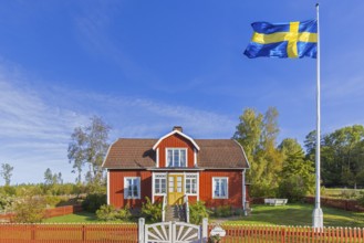 Katthult, red wooden farm house with fence from Astrid Lindgren's tales about Emil of Lönneberga at