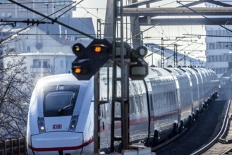 ICE en route on a railway bridge with tracks and signalling system. Mannheim, Baden-Württemberg,