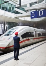 ICE at the centre platform with Deutsche Bahn staff, long-distance train station, airport,