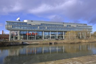 Modern building of the broadcasting station Arte of ARD and ZDF at the river Ill, bank, satellite