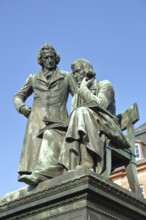 Brothers Grimm national monument, standing Jacob and sitting on the chair Wilhelm, brothers, bronze