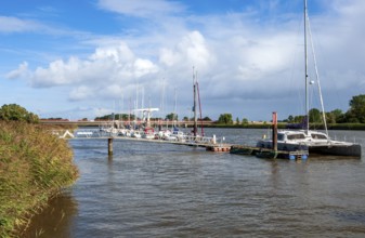 Sailing boats at the jetty in Geversdorf (district of Cadenberge) on the Oste, behind bascule