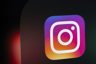A close up of an iPad screen displaying the instagram app icon
