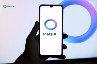 Meta AI logo on smartphone for Facebook Artificial Intelligence.