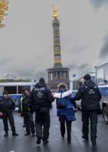 Germany, Berlin, 28 October 2023, Removal of a woman by police officers, Victory Column, Europe