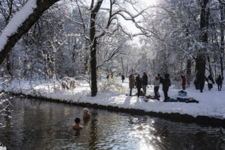 Ice bathing in the stream, people, stream and trees, winter with snow in the southern part of the