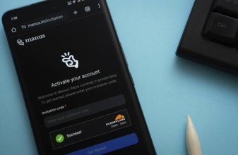 Homepage of Manus AI is seen on a smartphone